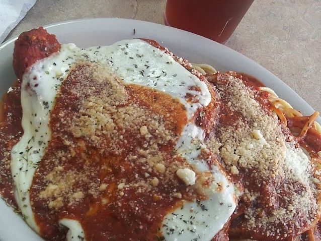 A plate of pastitsio, baked noodles with seasoned ground beef and bechamel under marinara